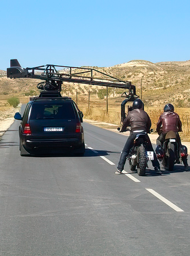 motorbike shoot in desert road spain with camara-car